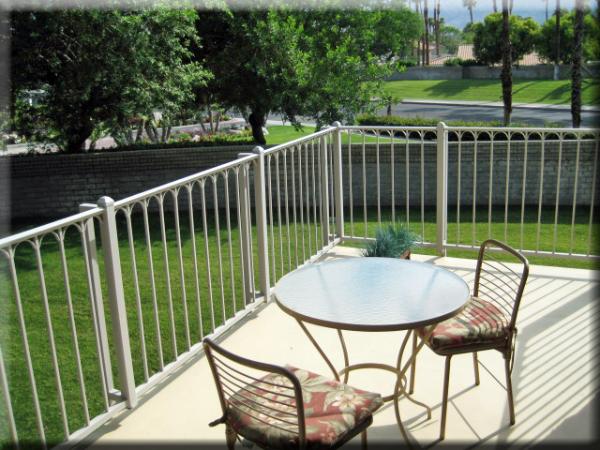 palm trees view from second patio and patio furniture